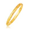 Size: 7” – 14k Yellow Gold Domed Bangle with a Weave Motif